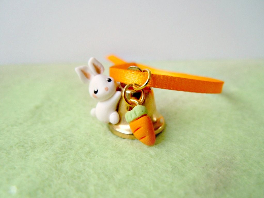 Tiny bunny on a bell - with orange ribbon and carrot charm