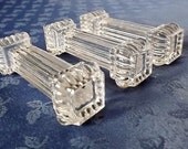 Three glass knife rests from France