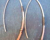 Copper "wishbone" earrings, hand-hammered and textured. Medium sized asymmetrical one-piece women's copper earrings with copper beads.