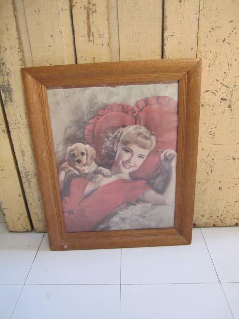 Girl next door framed picture.