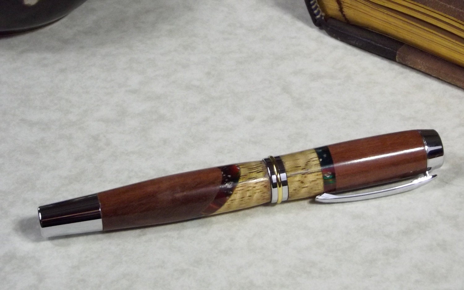 Handmade Commissioner fountain pen in curly mango, chechen and acrylic with chrome hardware