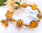 Gold Artisan Crafted Lampwork Glass Bead Bracelet