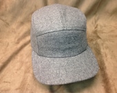 5 panel dark grey wool cap. Fitted or adjustable sizes available, more fabric choices