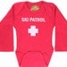 Ski Patrol Long Sleeve Graphic Onesie in Red