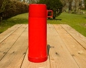 Red and white thermos flask
