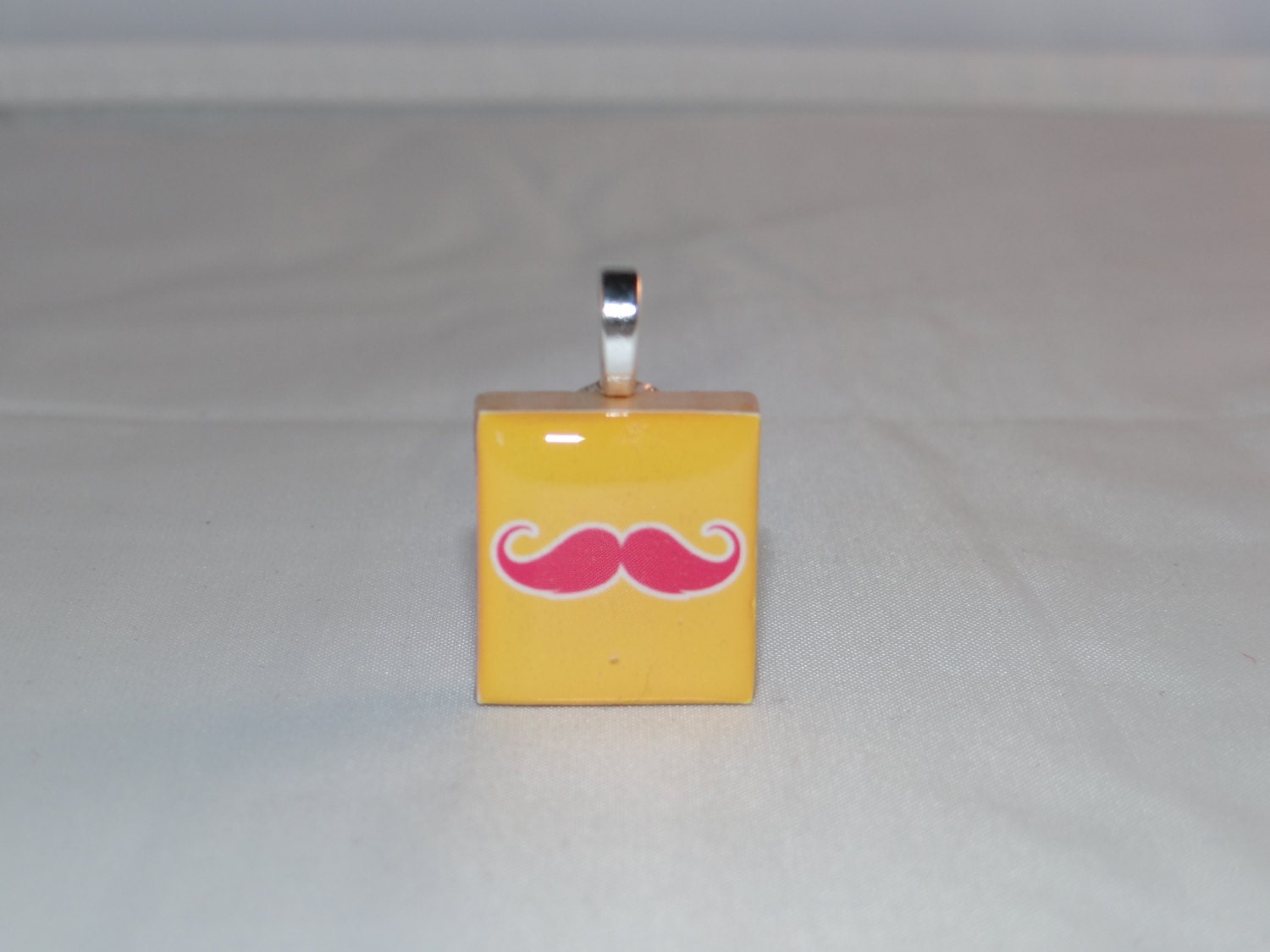 Mustache Pendant - yellow background pink mustache