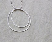Organic silver hoop necklace.  Handmade hoops, with delicate chain