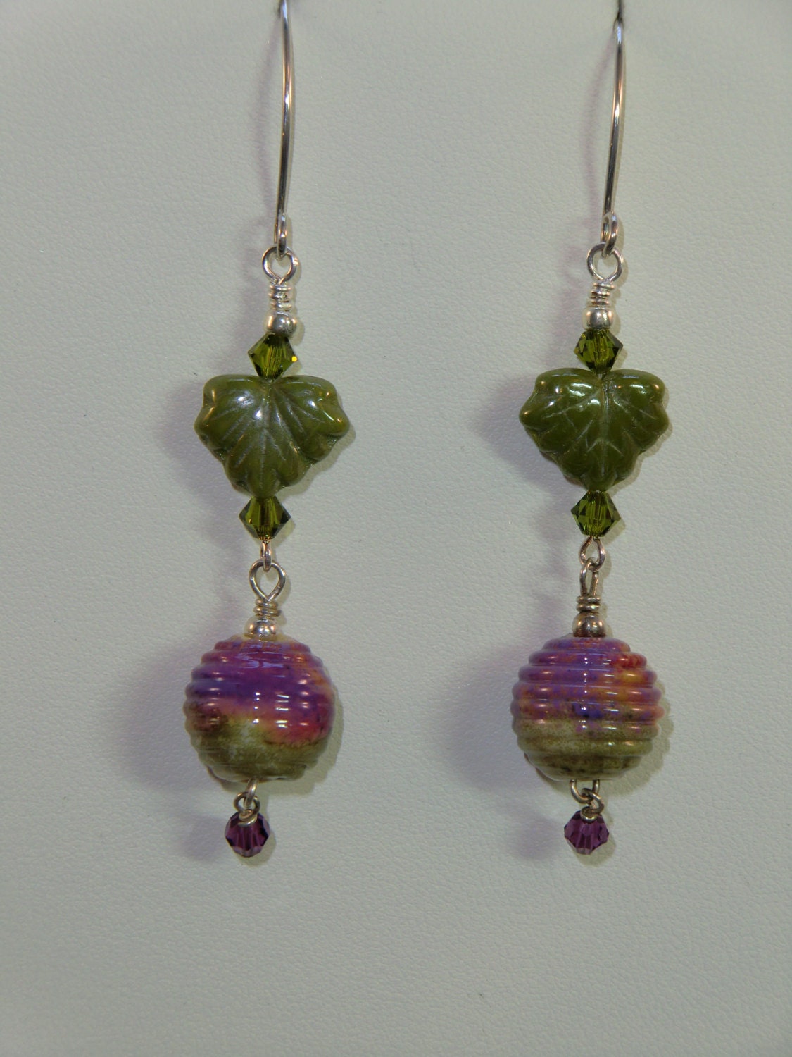 Olive green, purple and tan coiled lampwork dangle earrings with green Czech glass leaves and  swarovski crystals