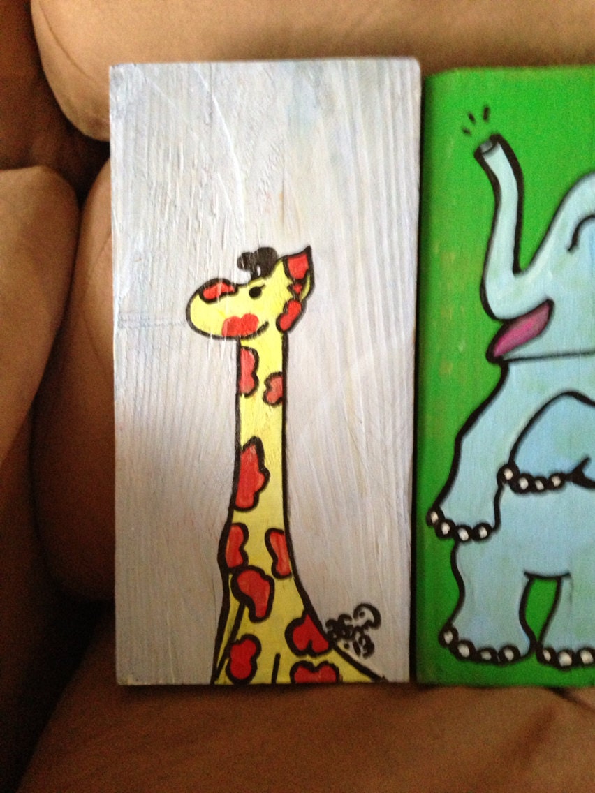 Jefry the giraffe on blue wooden block roughly 5x9