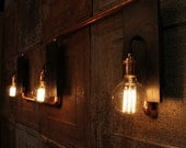 Reclaimed wood sconces with copper hardware by Urban Chandy
