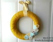 Yellow Burlap Wrapped Wreath with Chevron Bow and rolled fabric rosette flowers in tiffany blue