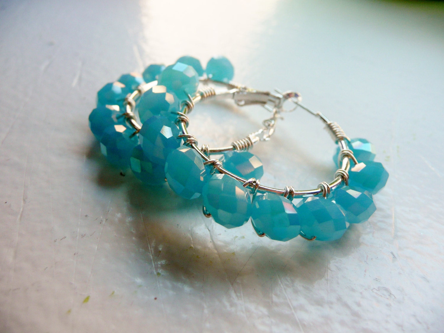 Silver Wire Wrapped Hoops with Bright Blue Crystal Beads