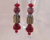 Red dangle earrings crafted from paper beads