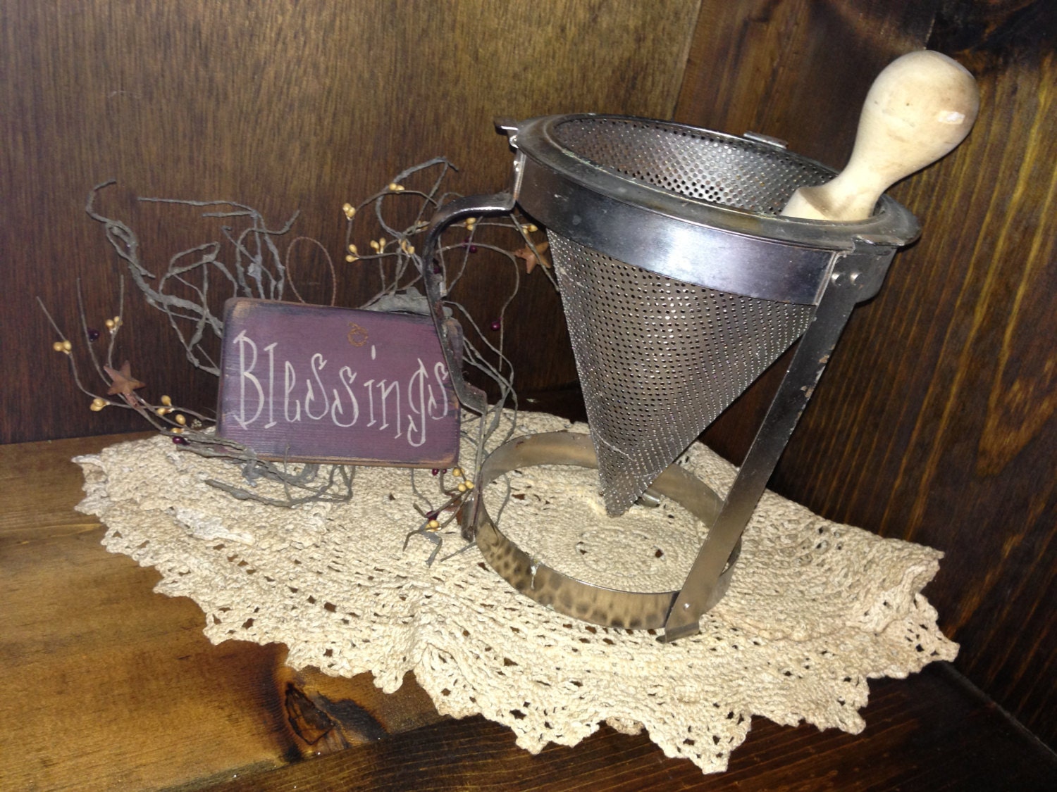 Vintage strainer with wooden pestle - great for use as a planter