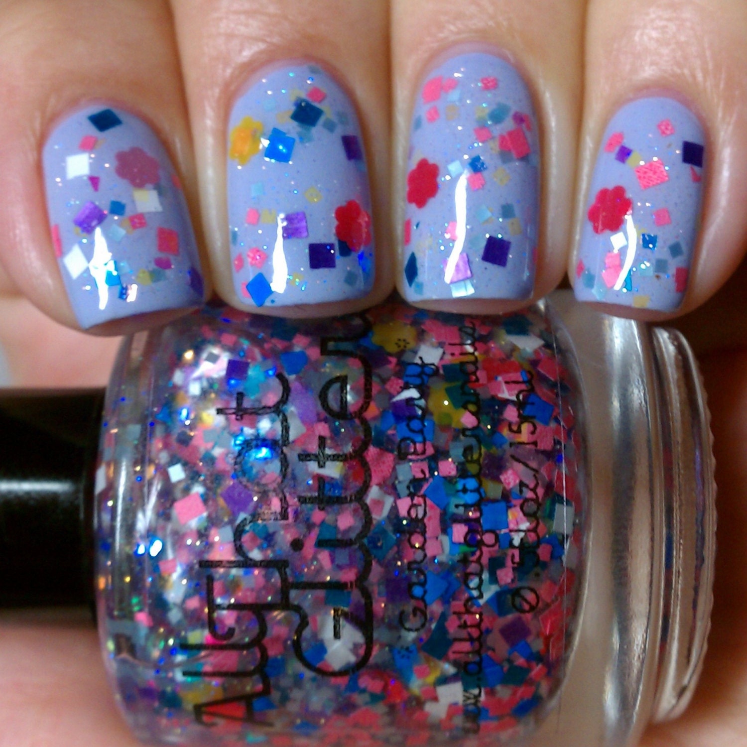 Garden Party - clear base with multi-colored square and flower glitter nail polish