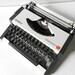 Vintage portable typewriter Olimpia Traveler de Lux Made in 1970s