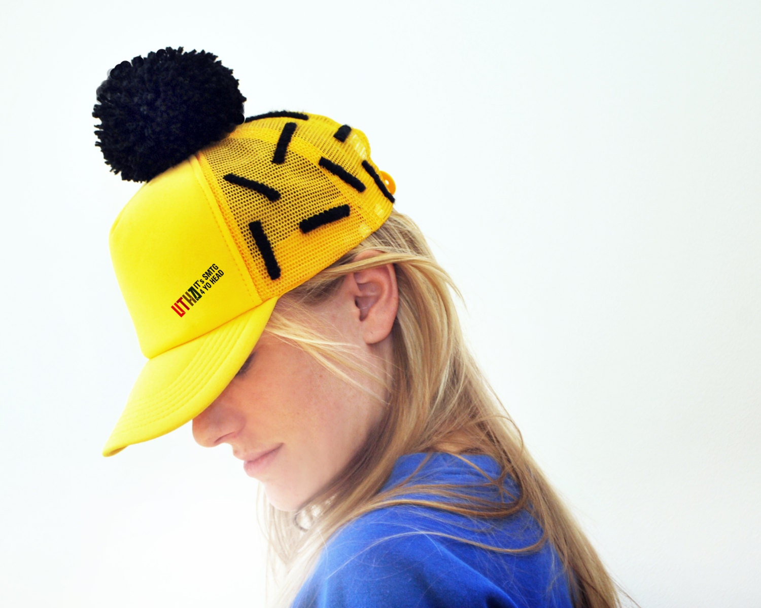 UTHA embroidered yellow trucker hat / cap with black pompom / festival hat