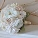 Vintage wedding bouquet, oldworld charm of lace and pearls among paper flowers and seafaom, blush pink and pastel peach fabric flowers
