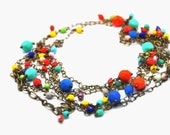 Joyful necklace made with multicolor Faceted Czech glass beads, and a delicate antiqued brass chain made with hearts