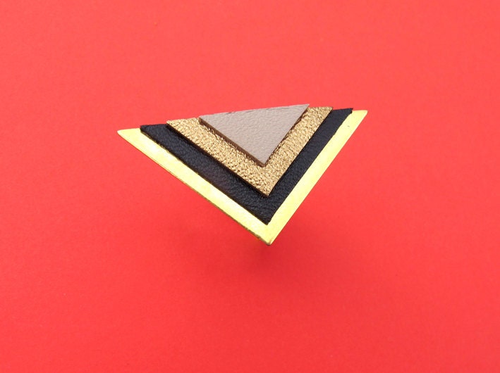 Arena ring, art deco style, triangles in leather, very graphic and modern