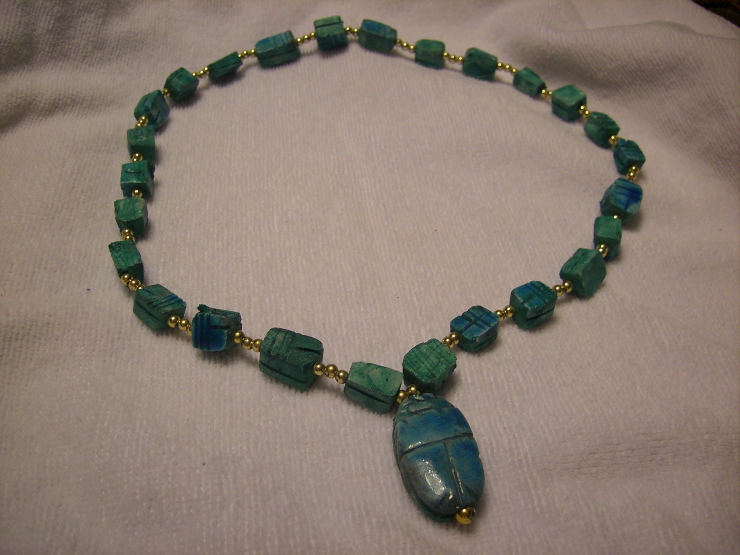 Egyptian revival art deco scarab necklace. multiple scarabs with gold colored beads