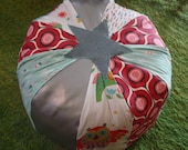 custom repurposed upcycled vintage modern fabric pouf ottoman for baby's nursery or child's room