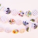 Vintage Image Paper Garland. Hand-punched & sewn. Made using vintage children's images