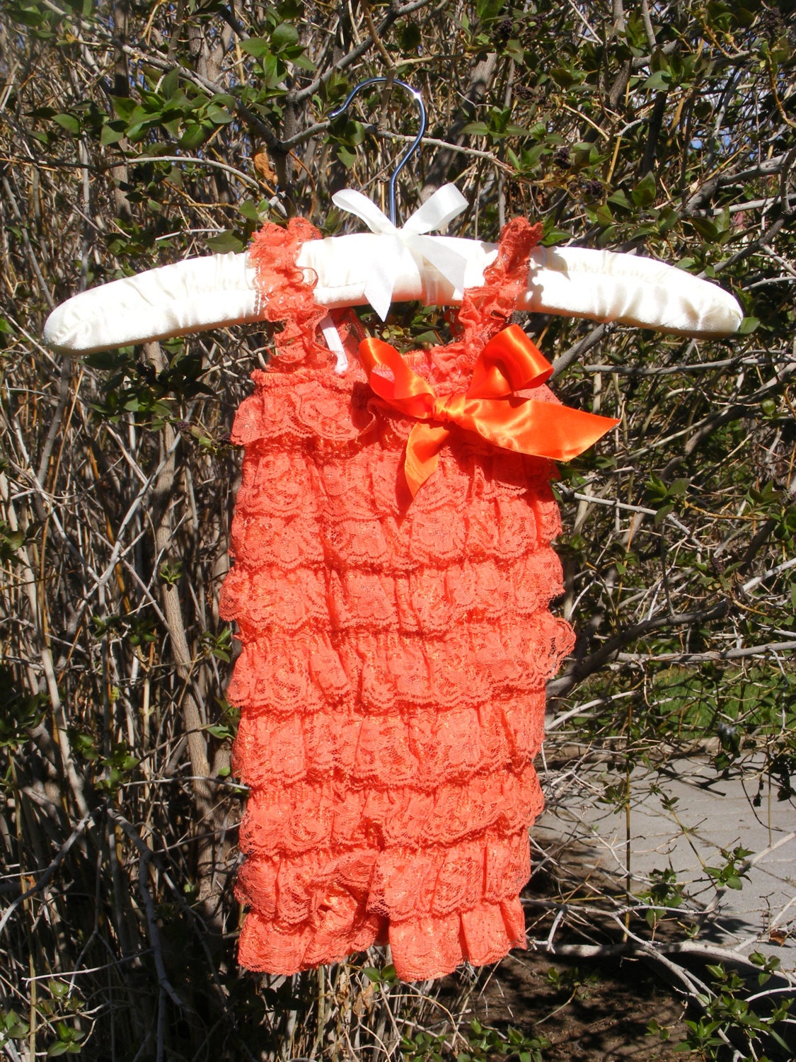 Orange Lace Romper with Matching Headband.