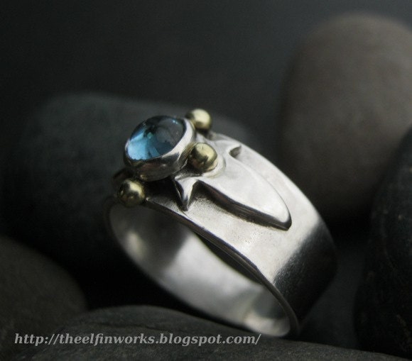 Blue topaz ring, simple sterling silver band, raised central star burst pattern, handmade, size 7 &1/4, and Elfin Works design