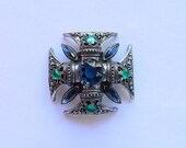 Signed Vintage Florenza Regal Maltese pendant brooch with emerald green cabochon chatons and sapphire colored rhinestones