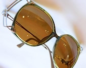 Captivating Dior Vintage oversized sunglasses with gold-flecked olive green frames and silver cage details