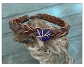 Braided leather cord with blue beach glass wrapped with silver wire