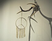 woodstock.  a sacred sun macrame wall hanging.