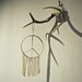woodstock.  a sacred sun macrame wall hanging.