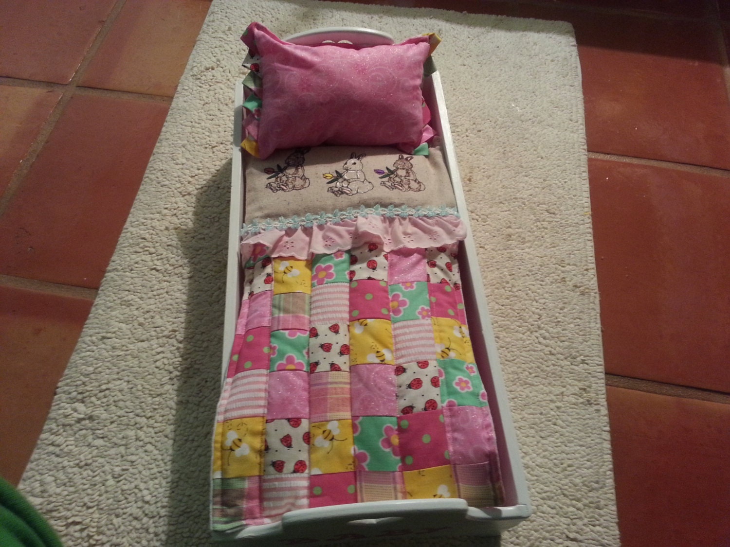 little girls wooden doll bed with bunny quilt beautiful pink colors