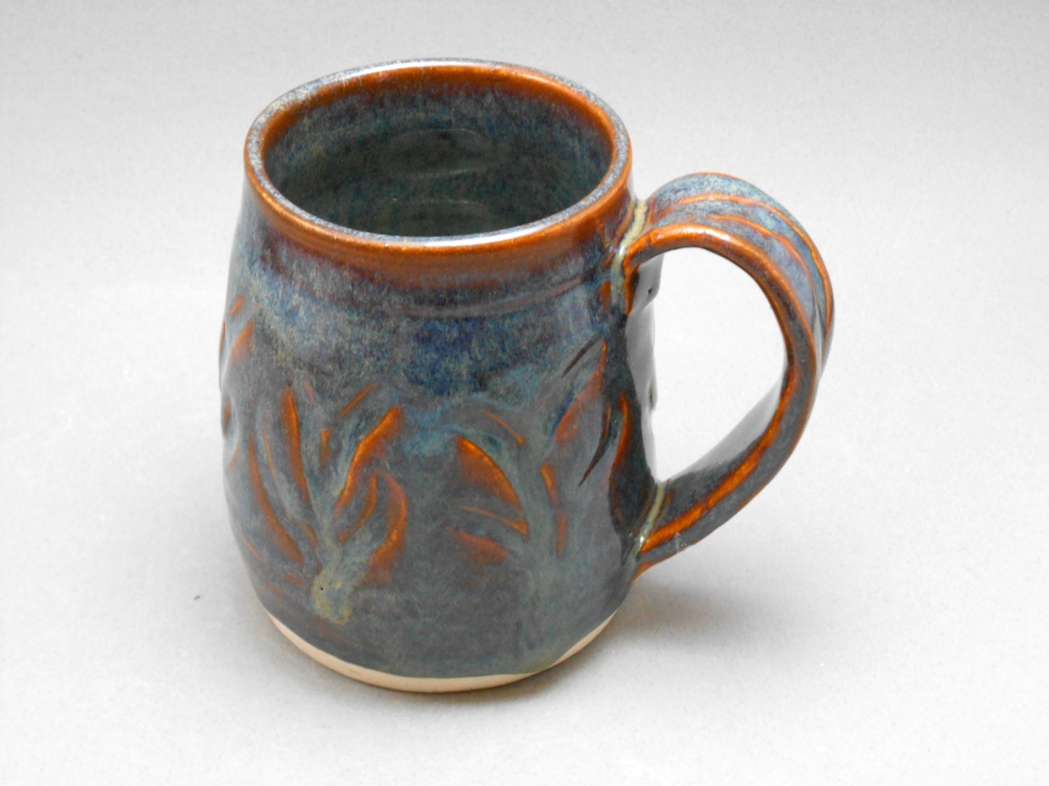 Handmade ceramic mug, coffee or tea cup, brick red with blue highlights O3