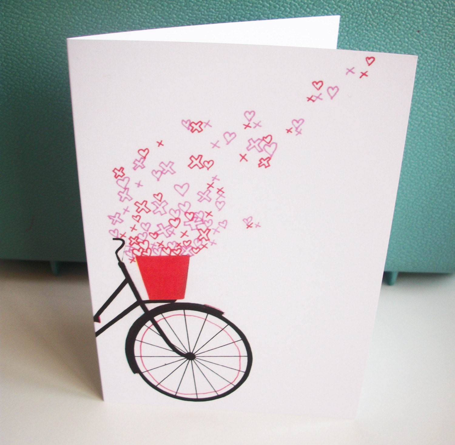 Hearts and kisses bicycle greetings card. blank bike card.indie bicycle basket hearts kisses illustrated card.bike illustration.collage.