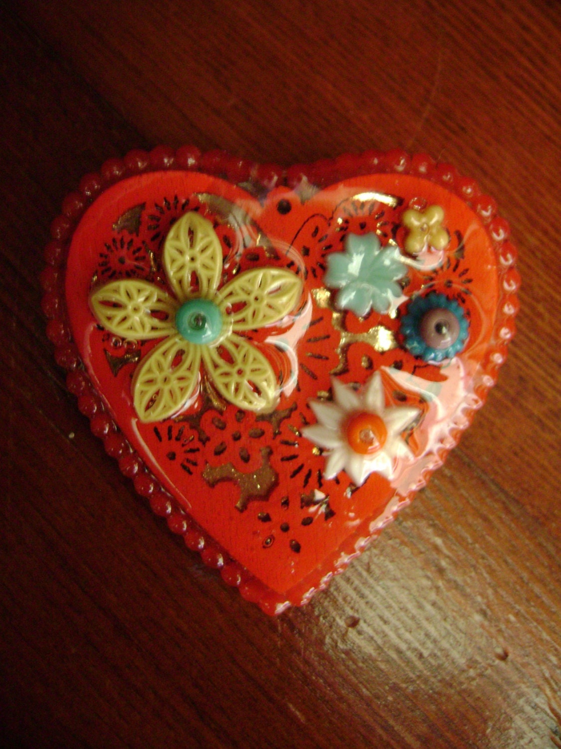 bright red assemblage heart brooch