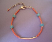 Hand-made thin bracelet with turquoise and coral colored beads and a silvery tube - Gypsy chic jewel