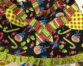 Girls Children/Toddler Apron size small in "CHRISTMAS CANDY". Red, green, white, blue. Polka dots, stripes, checkered, holly, candy canes