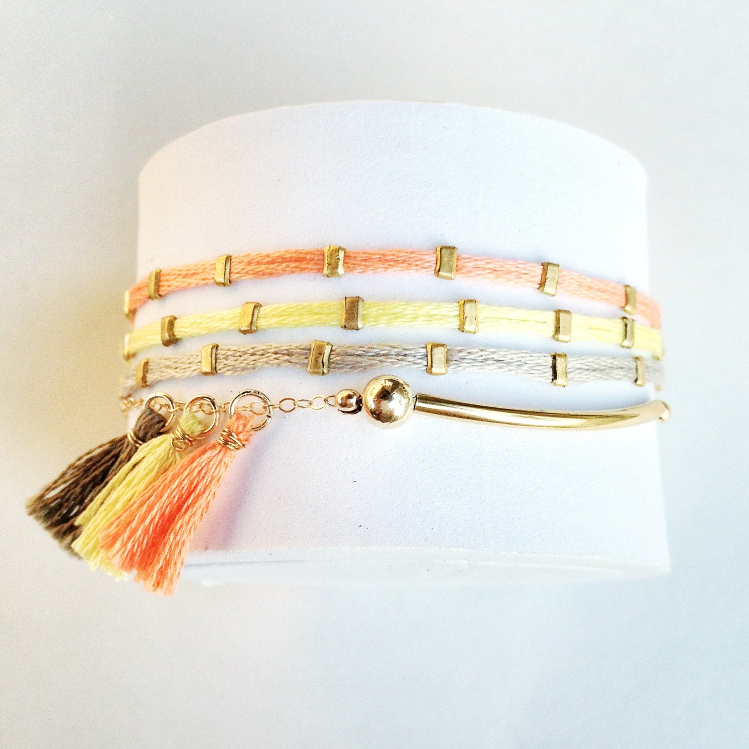 Arm Candy Multi row bracelet stacks with fun. tassels.Trendy Spring colors. For everyday