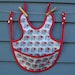 Adjustable waterproof bib, elephant print, with snaps and pocket