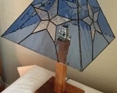 A rustic Lone Star lamp handmade from stained glass and mesquite.