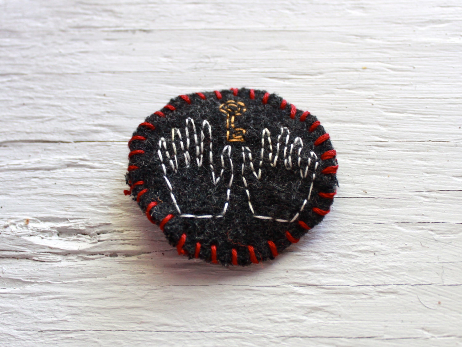Hand and Key Pin