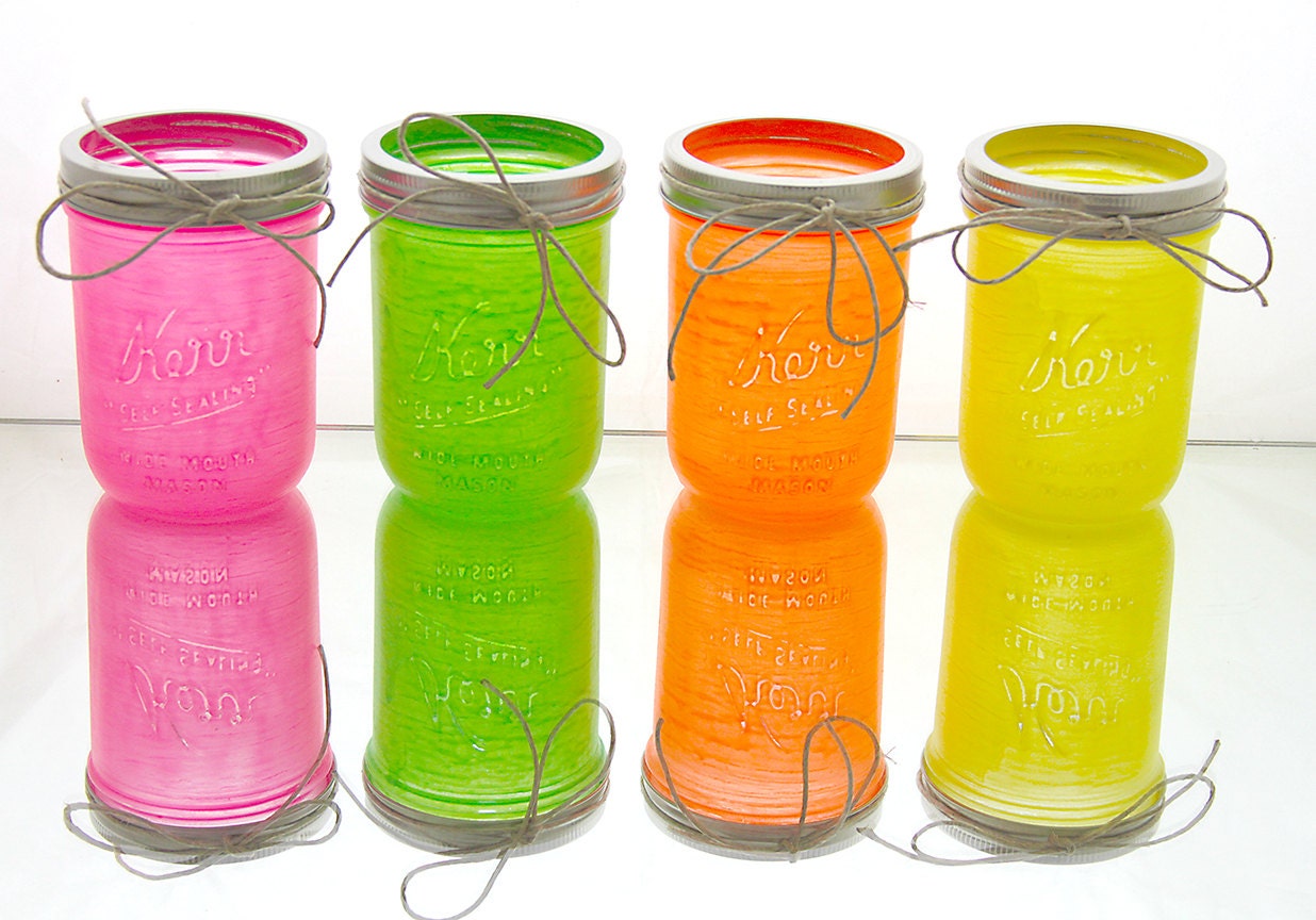 Glow in the dark mason jars in neon pink, green, orange, and yellow wedding centerpiece home decor