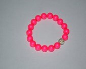 Neon Swarovski pearl bracelets adorned with Swarovski pave beads
