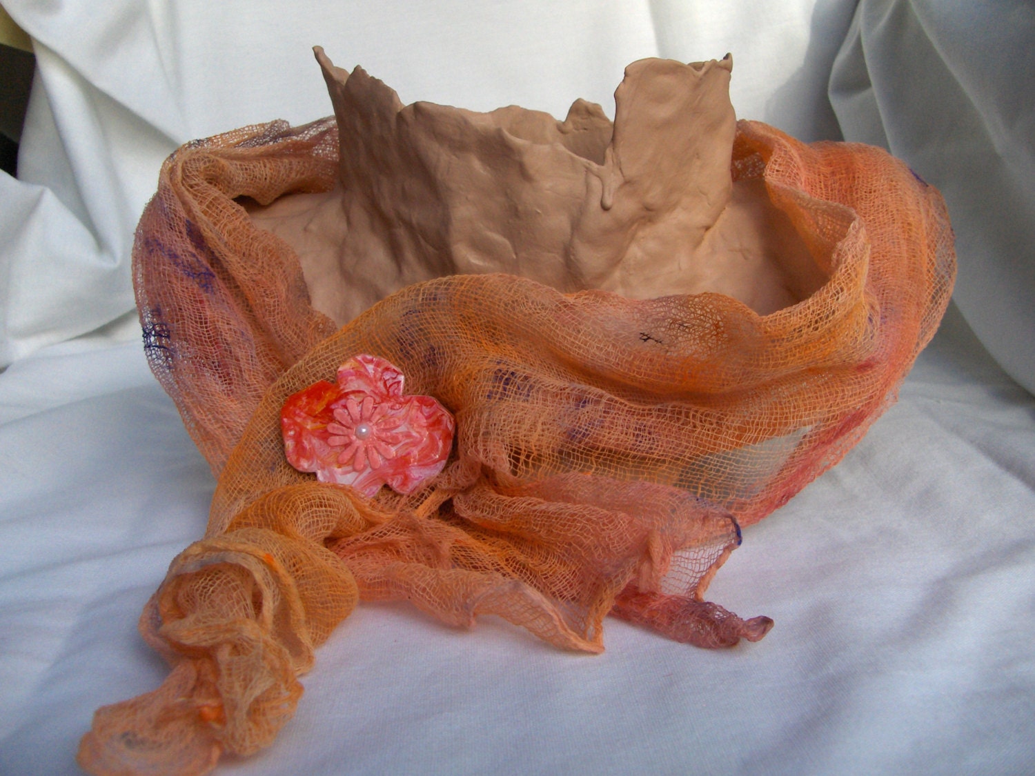 Scarf and Brooch Set in burnt orange with a pink flower on the orange and pink brooch