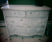 4 drawer chest of drawers (white distressed oak) with ornate pulls and glass-like finish