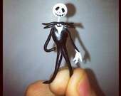 Tiny clay sculpture of jack the pumpkin king from nightmare before Christmas. Cute strange