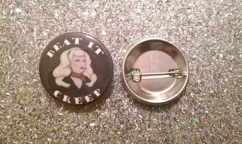 One 1 and one quater inch circle pin with BEAT it CREEP art by Lucky Hellcat Art